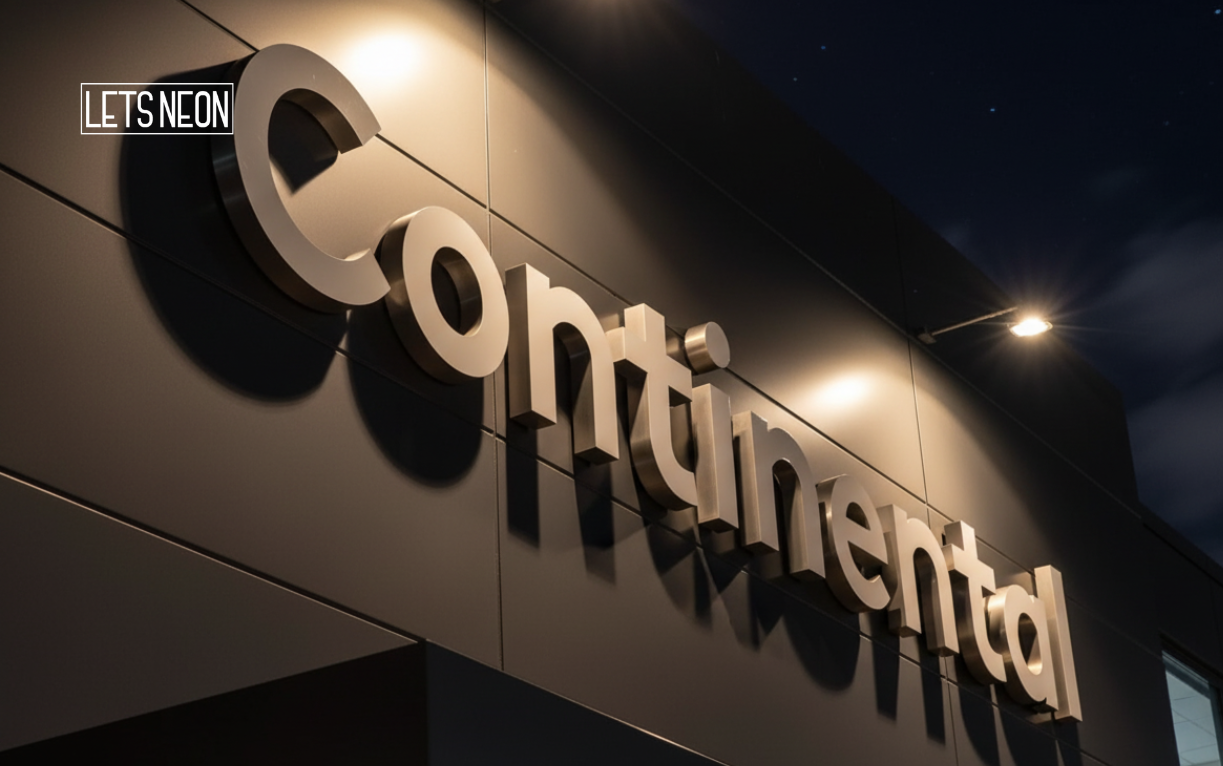 3D metal backlit sign glowing on building exterior.