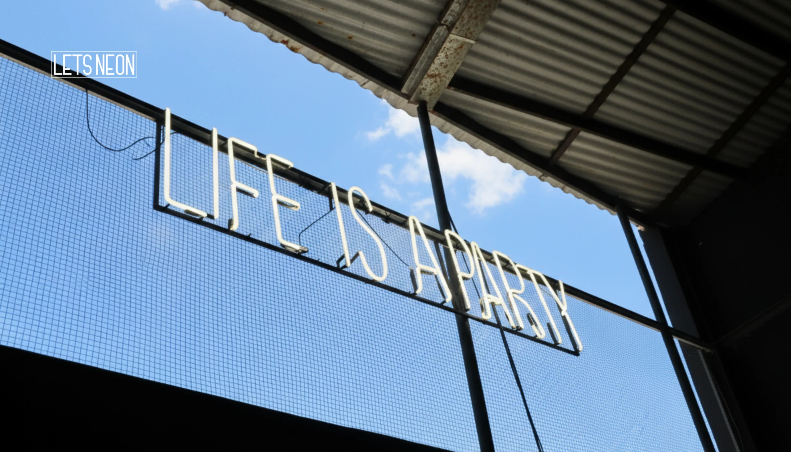Neon sign signs displayed indoors.